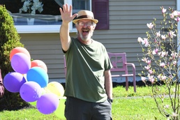 Fort Drum NEC members surprise colleague with drive-by retirement parade