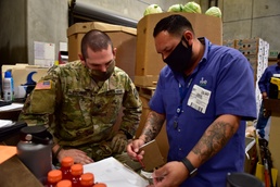 Soldiers with forklift certification aid FIND Food Bank warehouse mission