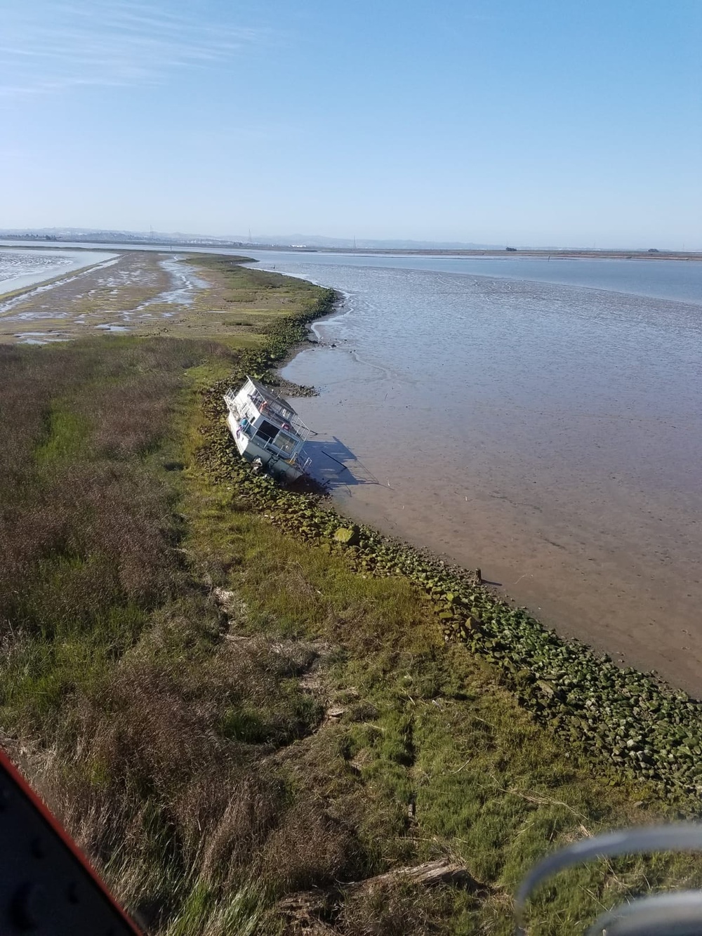 Coast Guard aircrew rescues 2 from aground houseboat in Napa River