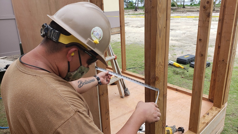 U.S. Navy Seabees with NMCB-5’s Detail Pohnpei build head and shower facilities to help prepare a COVID-19 response compound