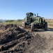 U.S. Navy Seabees with NMCB-5’s Detail Iwakuni work on a landfill capping project
