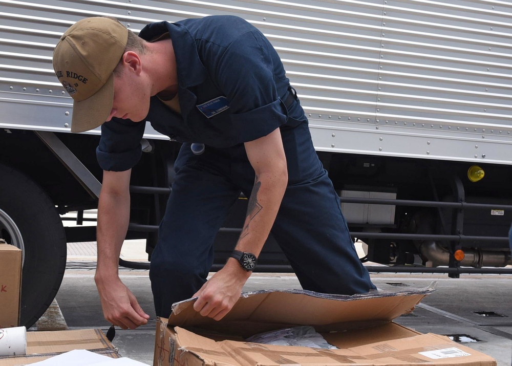 Sailors aboard USS Blue Ridge receive deliveries from Army Airforce Exchange Service (AAFES)