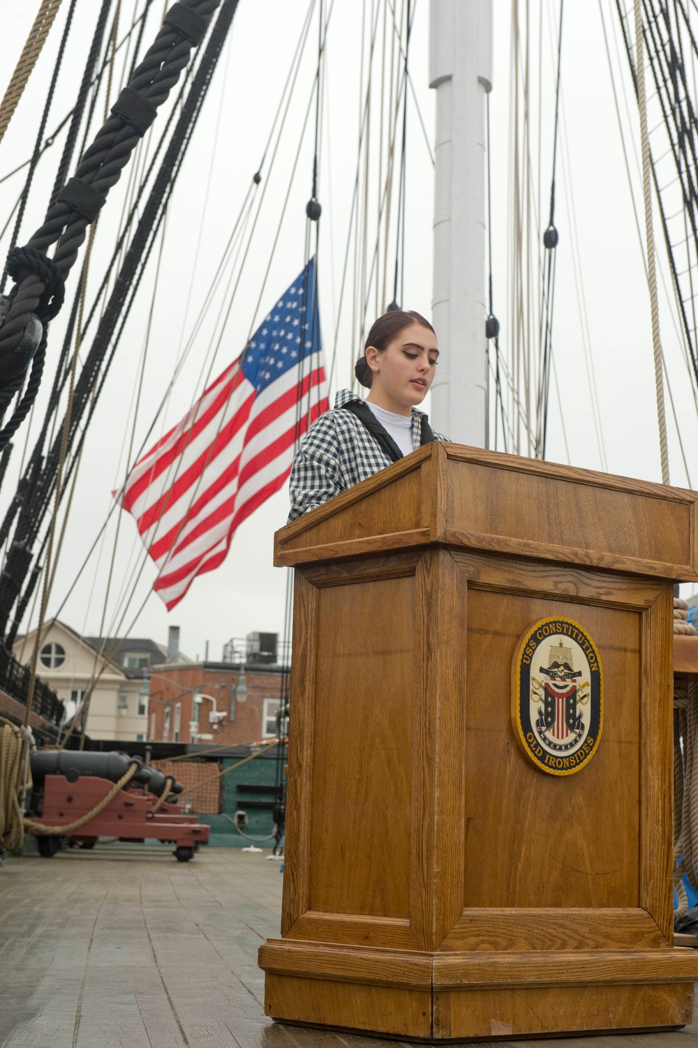 Airman Recruit Autumn Mackey reads the names of the fallen heroes aboard USS Constitution for Memorial Day