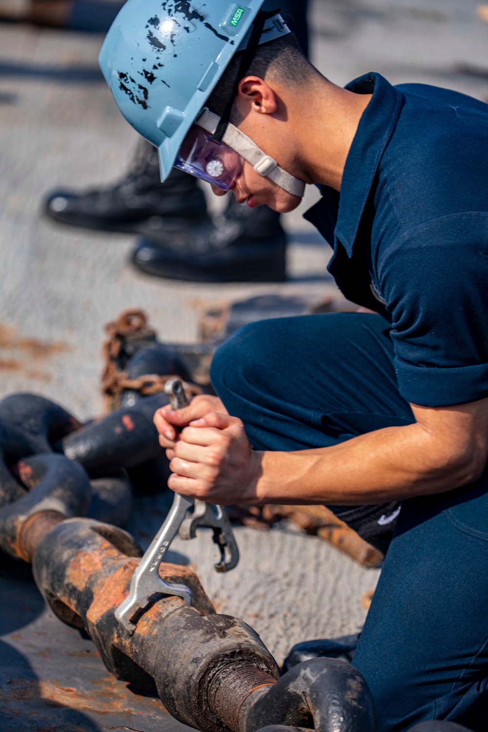 Sailors take part in an anchoring evolution