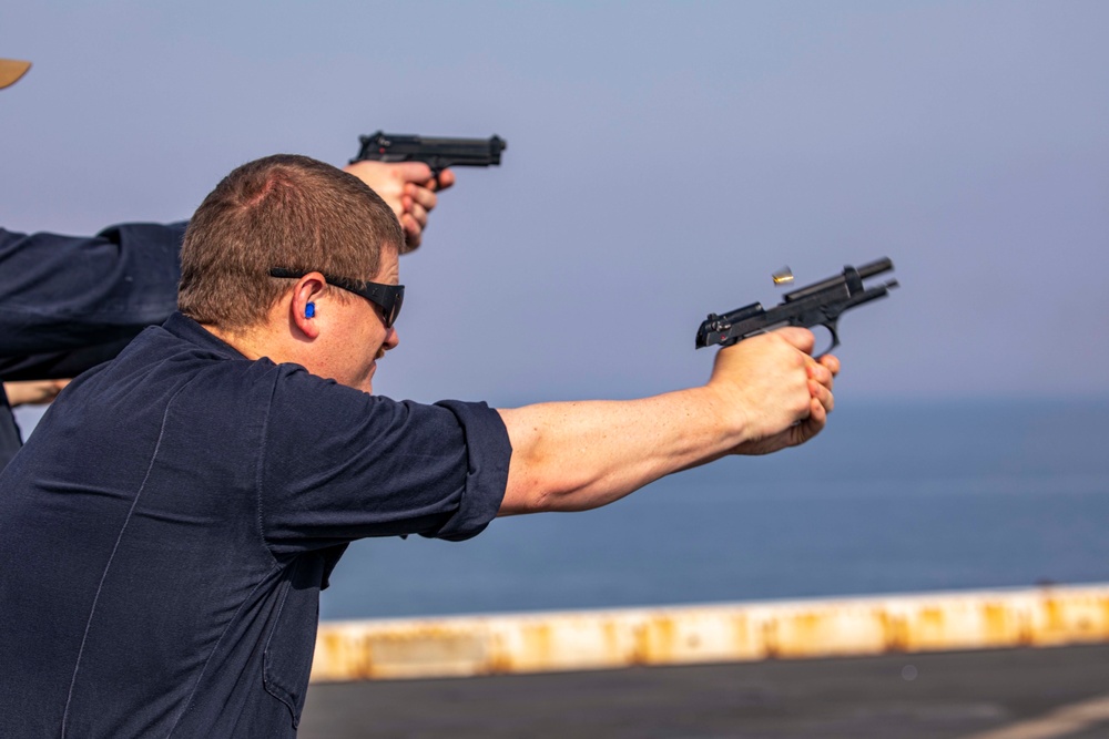 Sailors take part in a weapons qualification