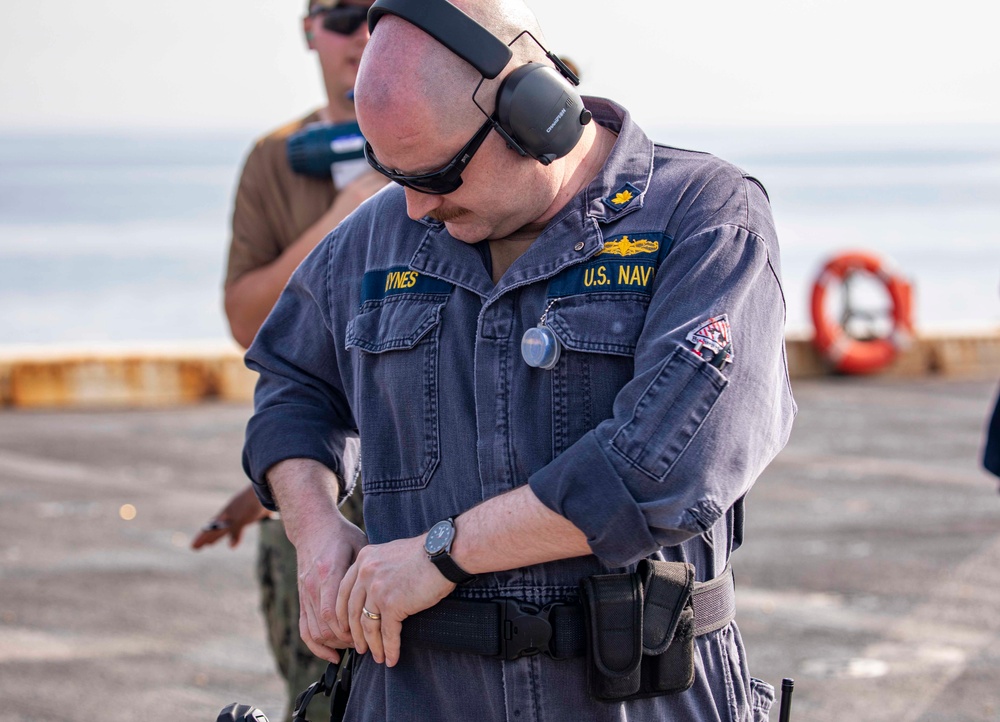 Sailors take part in a weapons qualification