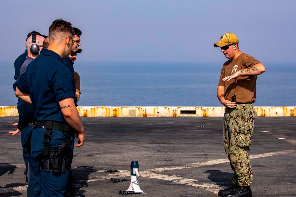 Sailors take part in a weapons qualification