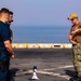 Sailors take part in a weapons qualification