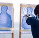 Sailors take part in a weapons qualification