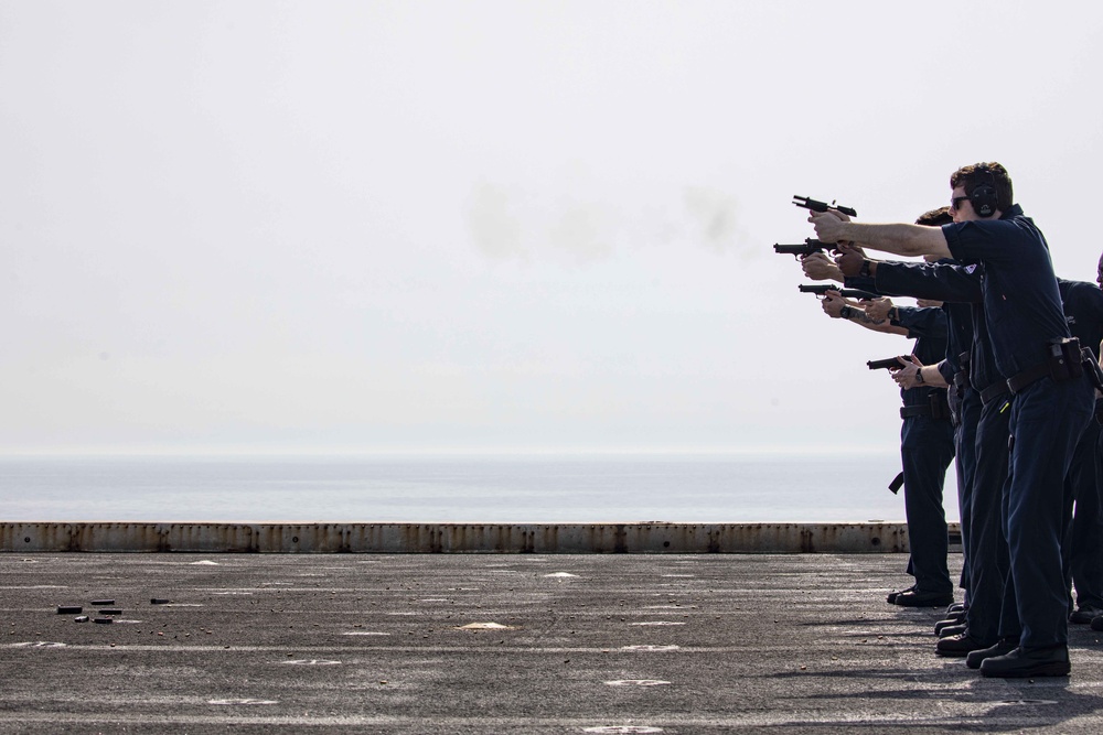 Sailors take part in a weapons qualification