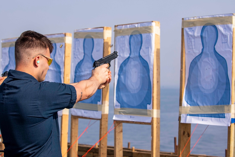 Sailors take part in a weapons qualification