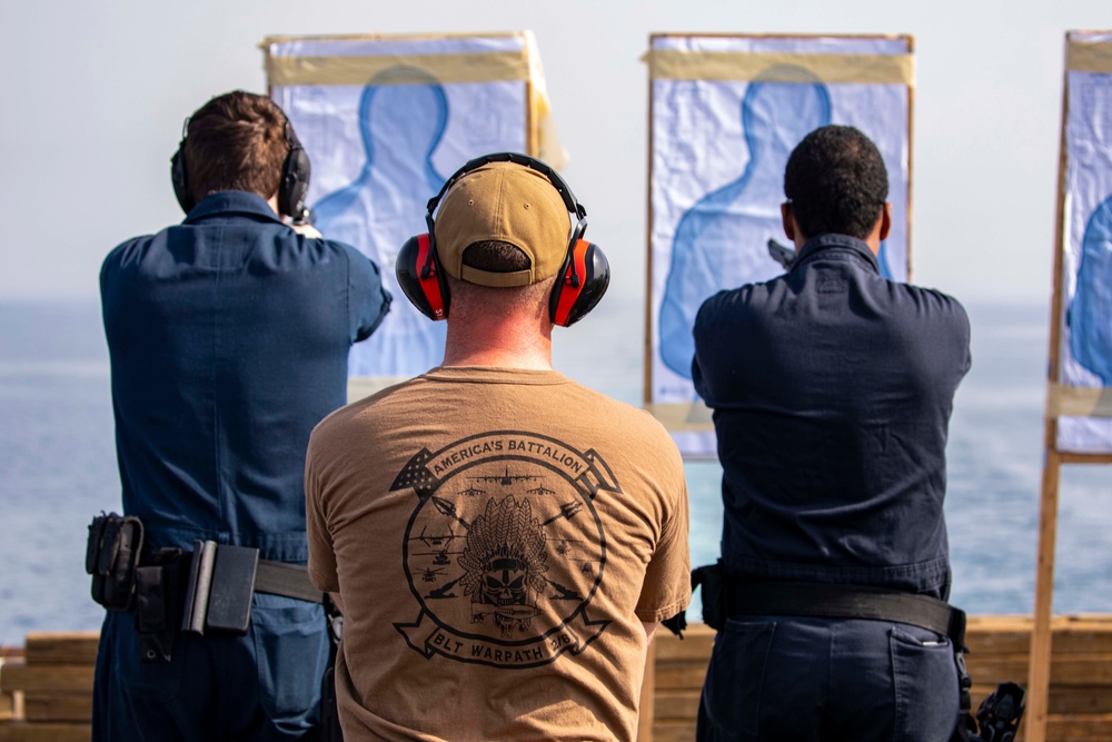 Sailors take part in a weapons qualification