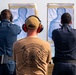 Sailors take part in a weapons qualification