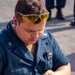 Sailors take part in a weapons qualification