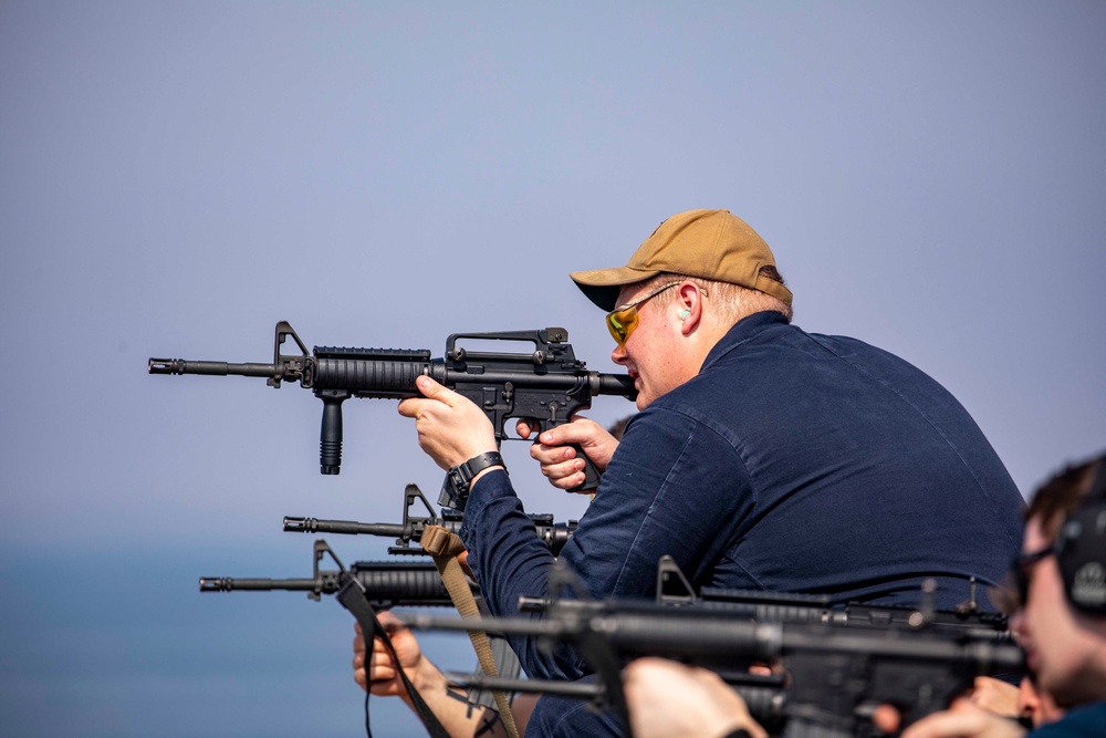 Sailors take part in a weapons qualification