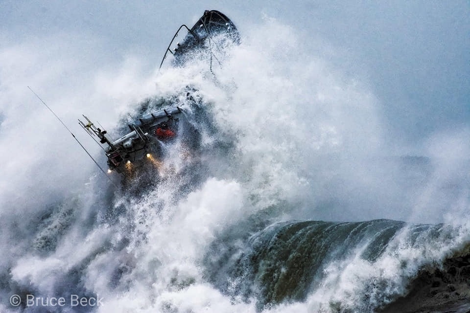 Petty Officer 1st Class Adam Presier operates in the surf near Brookings, Oregon