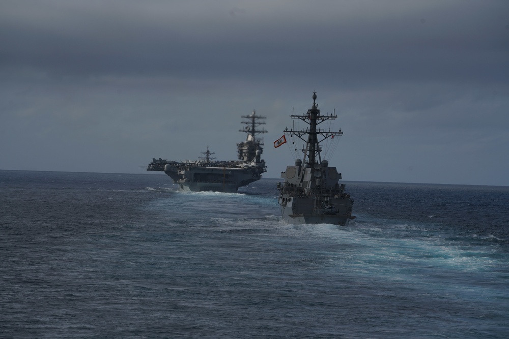 USS Ralph Johnson (DDG 114) and USS Nimitz (CVN 68) transit the Pacific Ocean