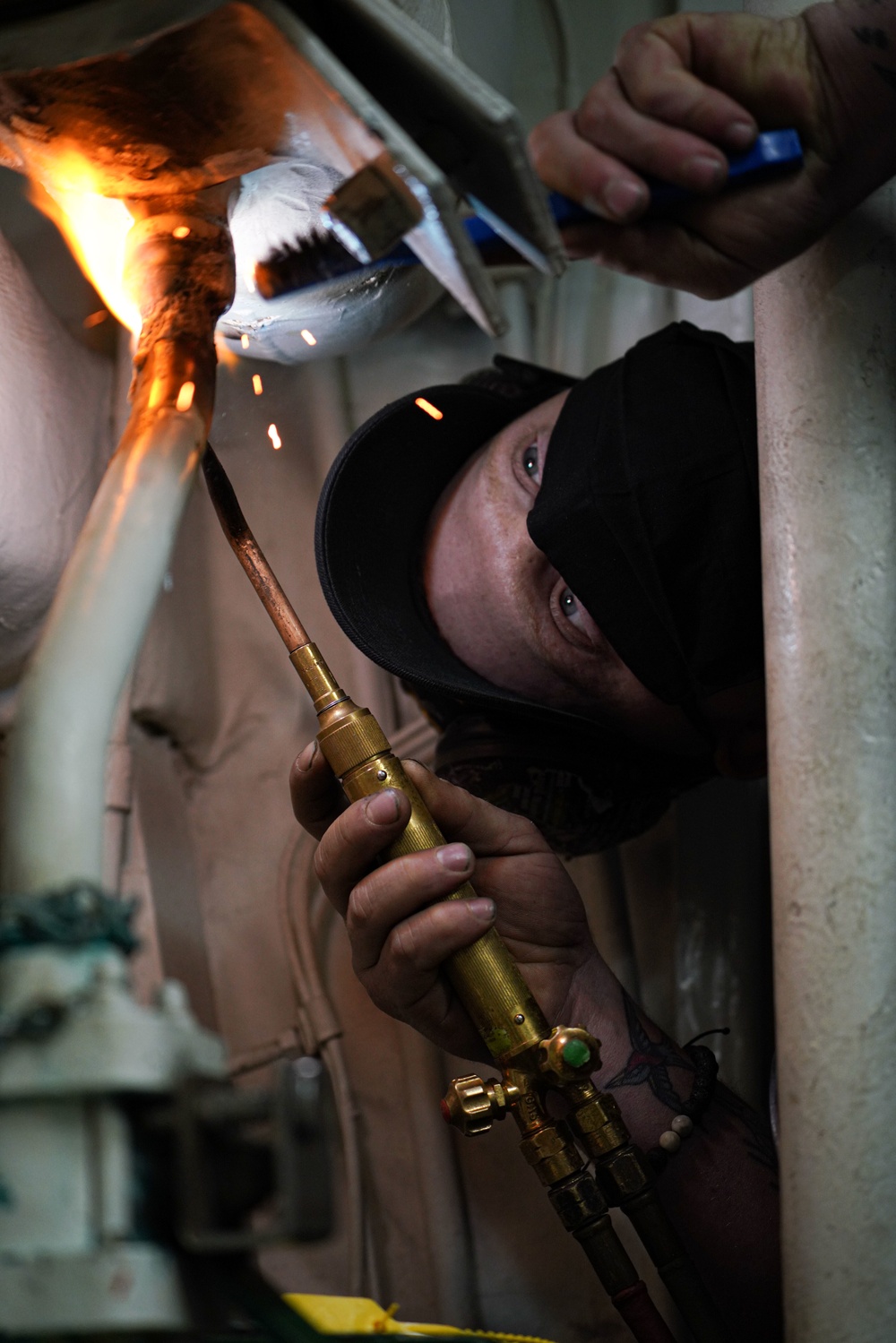 Hull Technician aboard USS Halsey braise welds