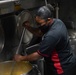 Culinary Specialist prepares food aboard USS Halsey