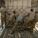 U.S. Airmen unload cargo from C-17 Globemaster III