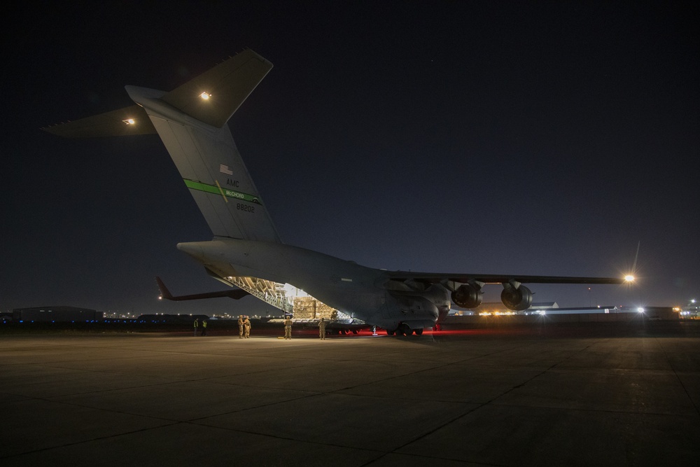 U.S. Airmen unload cargo from C-17 Globemaster III