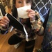 Miyuki Kamada demonstrates wearing a coffee filter between a mask