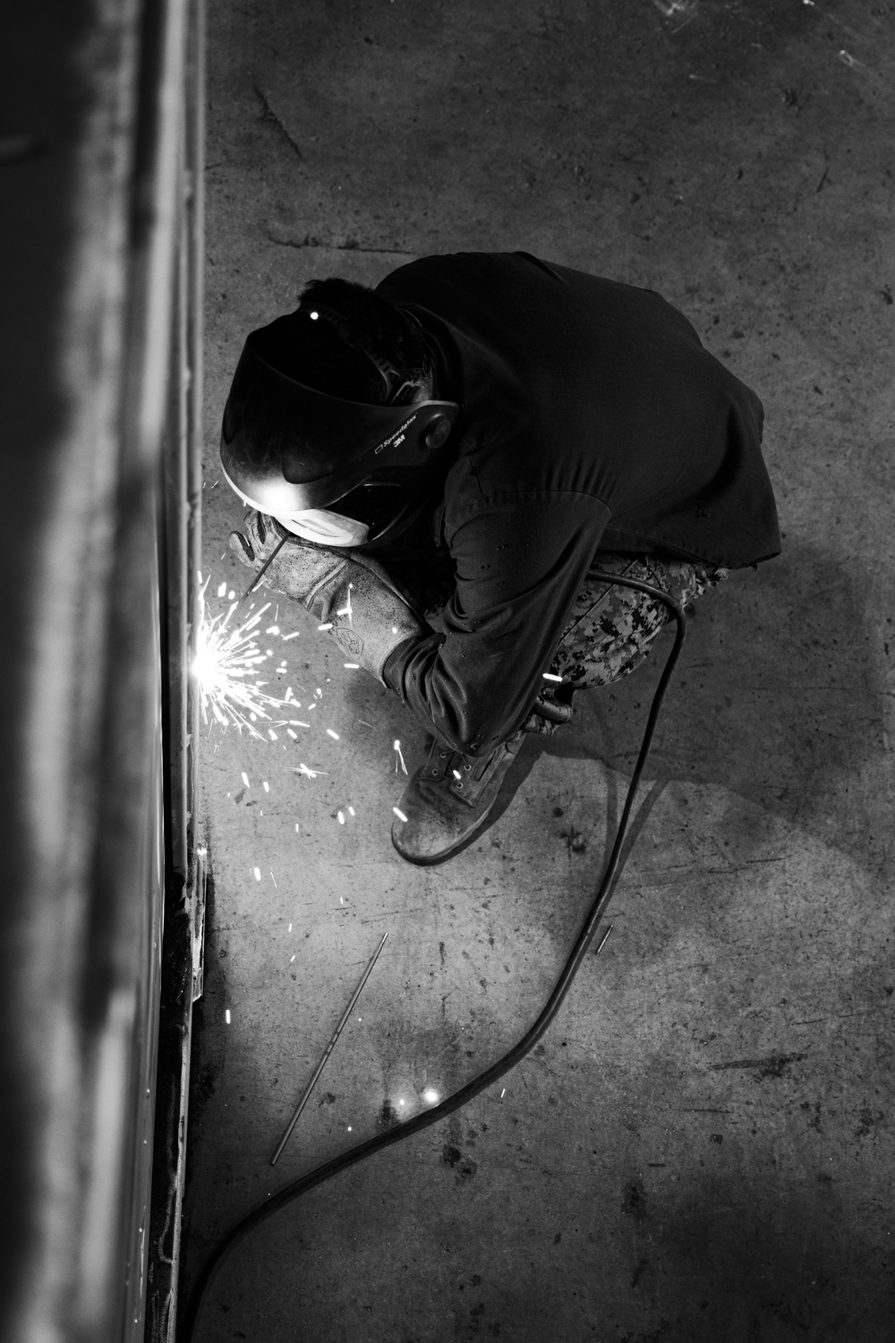 Bright Burn | 3rd MLG metal worker welds a Quadcon