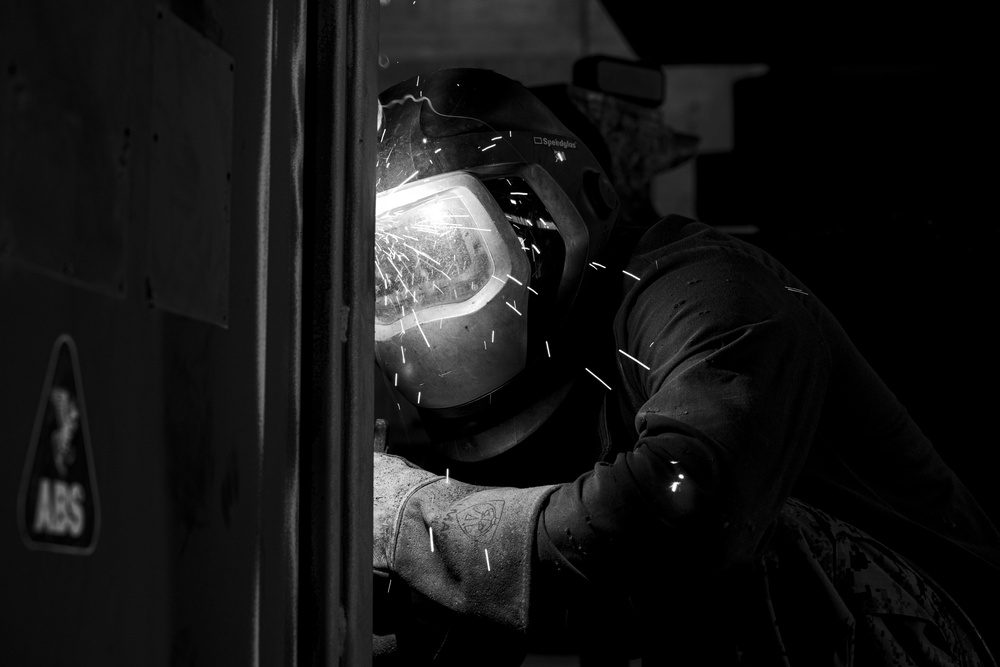 Bright Burn | 3rd MLG metal worker welds a Quadcon
