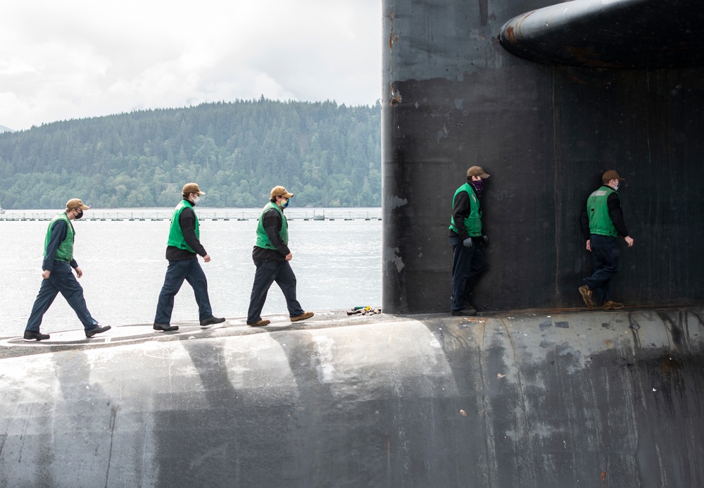 The gold crew of the Ohio-class ballistic-missile submarine USS Henry M. Jackson (SSBN 730) deploys on the boat's 100th patrol.