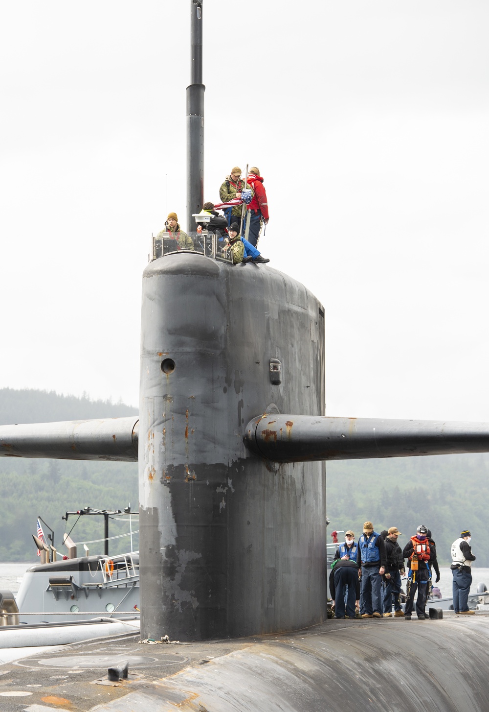 The gold crew of the Ohio-class ballistic-missile submarine USS Henry M. Jackson (SSBN 730) deploys on the boat's 100th patrol
