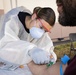 Navy Corpsmen with U.S. Naval Hospital Guam take samples from Sailors attached to USS Theodore Roosevelt for a CDC Study