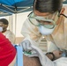 Navy Corpsmen with U.S. Naval Hospital Guam take samples from Sailors attached to USS Theodore Roosevelt for a CDC Study