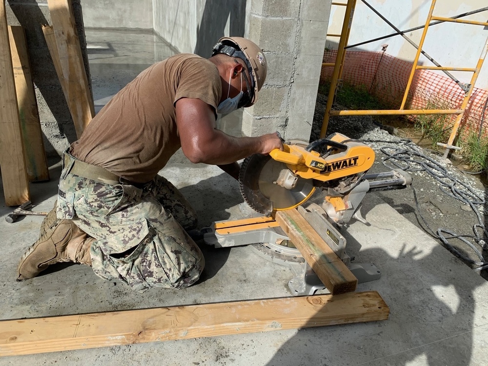 U.S. Navy Seabees with NMCB-5’s Detail Timor-Leste build a schoolhouse at Fatumeta’s school