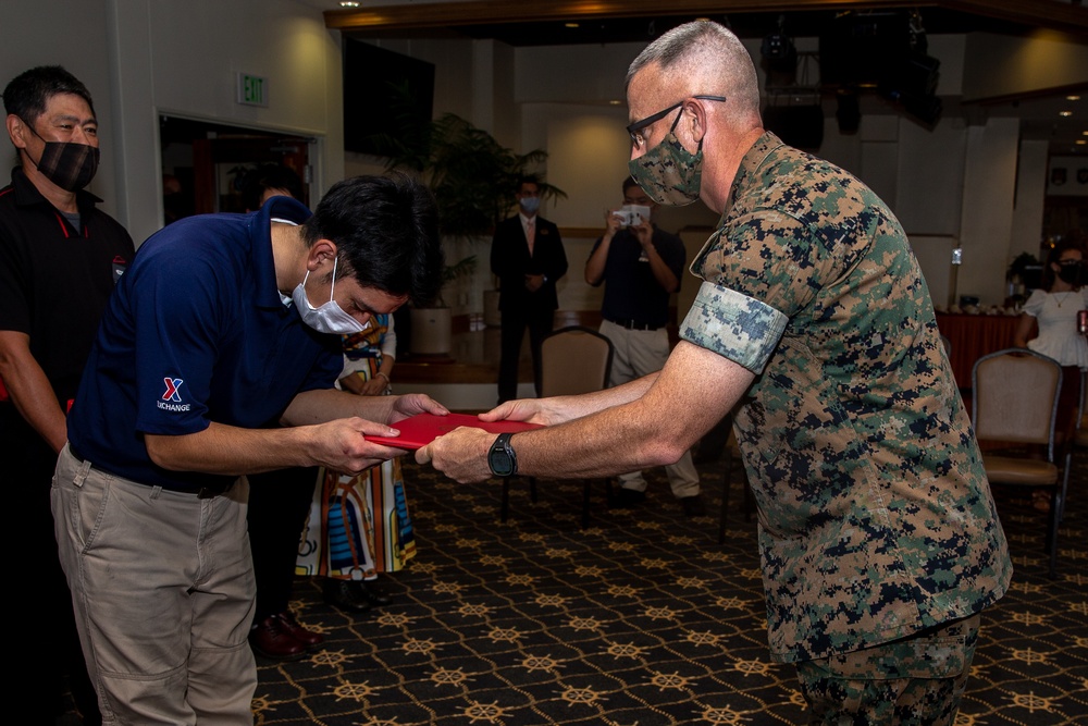 U.S. Marine Corps Col. Jason Perry presents awards during his change of command ceremony