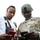 A civilian and a U.S. Army soldier are looking at their respective smartphones together. The soldier is wearing full combat uniform including a ballistic helmet and multicam camouflage, with visible rank insignia indicating a senior non-commissioned officer. They appear to be sharing or comparing information on their devices.