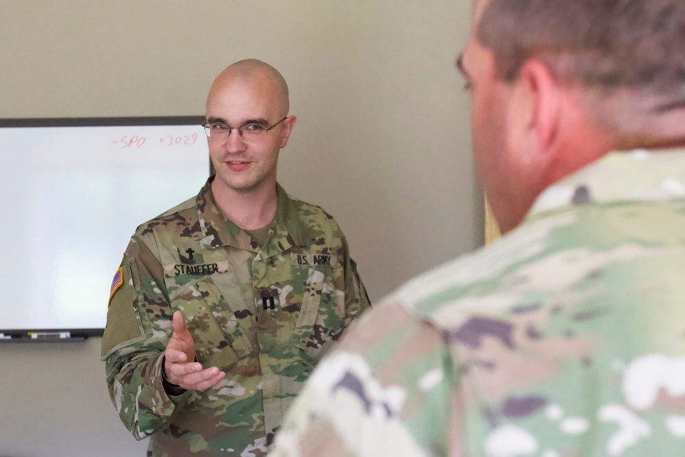 Chaplain Briefs Commander During COVID-19 Relief
