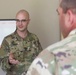 Chaplain Briefs Commander During COVID-19 Relief