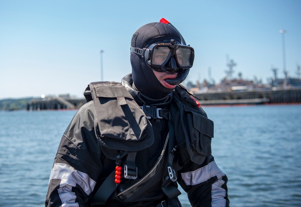 USS Carl Vinson (CVN 70) Sailor Stands on a Rigid Hull Inflatable Boat