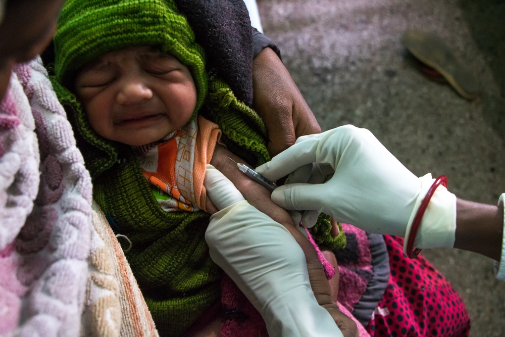 A newborn is vaccinated at District Hospital Saraikela in India