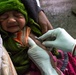 A newborn is vaccinated at District Hospital Saraikela in India