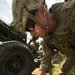 Howitzer section chief reads targets for fire mission
