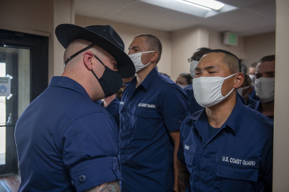 CAPE MAY, N.J. - Petty Officer 2nd Class Joshua Duran instructs recruits on uniform maintenance