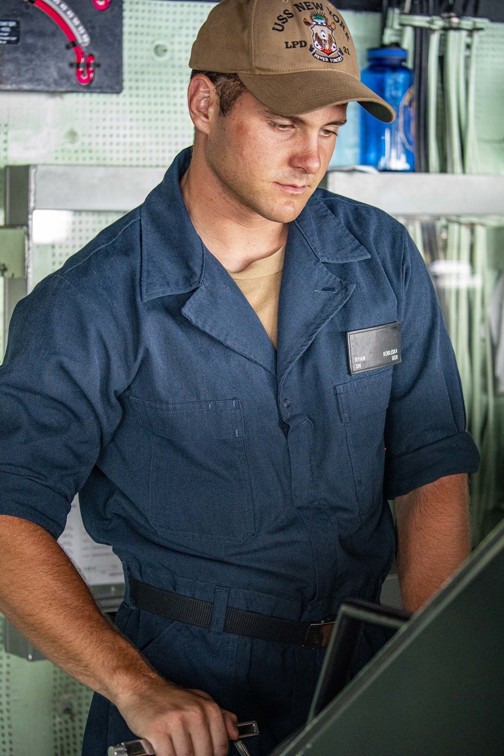 Sailors stand watch aboard the New York