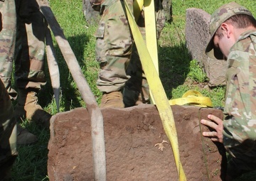 NY National Guard Soldiers repair World War 1 Guard Soldier's marker
