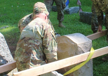 NY National Guard Soldiers repair World War 1 Guard Soldier's marker