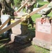 NY National Guard Soldiers repair World War 1 Guard Soldier's marker