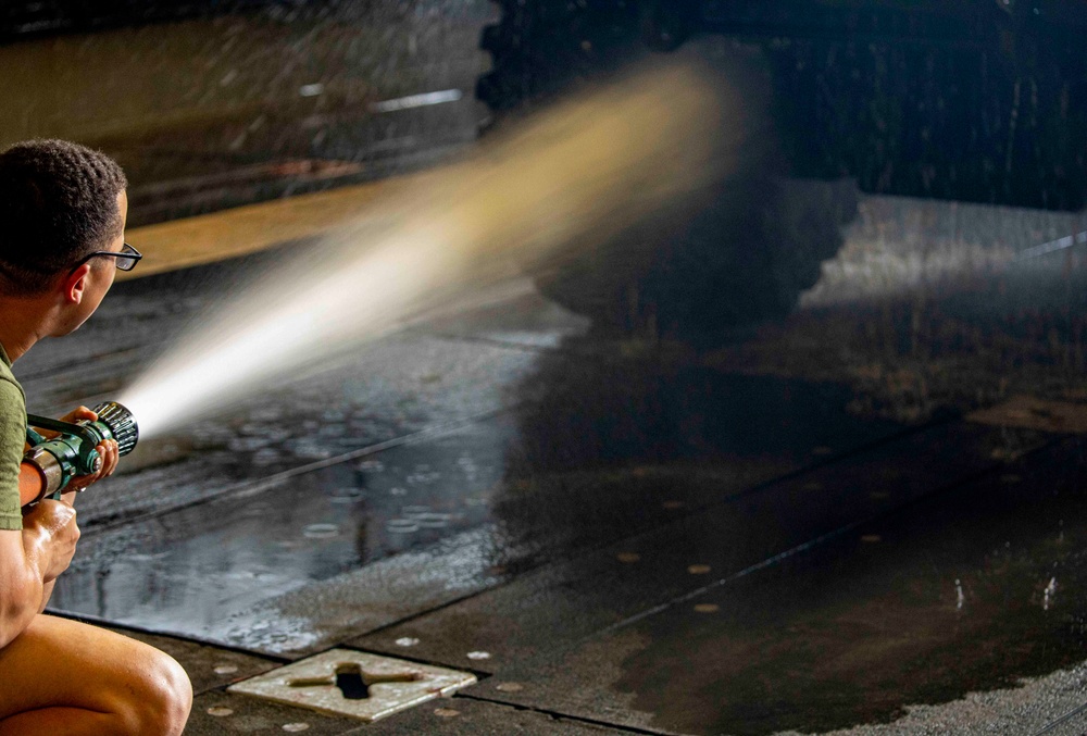 Sailors and Marines take part in vehicle wash down