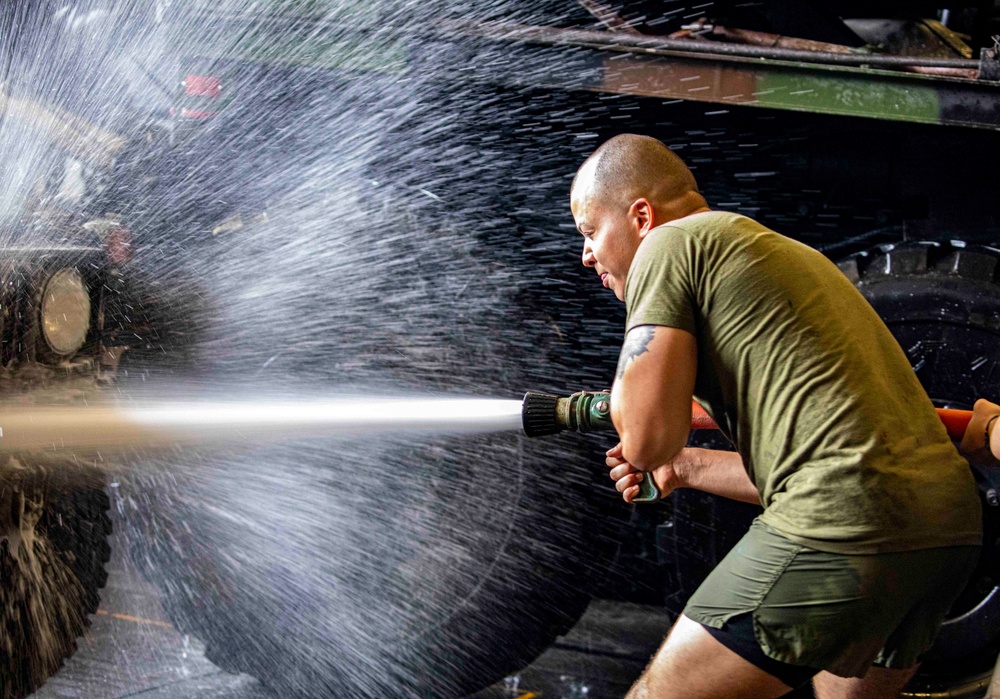 Sailors and Marines take part in vehicle wash down