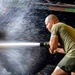 Sailors and Marines take part in vehicle wash down