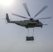 Helicopter support team transports AV-8B Harrier engine from USS Bataan